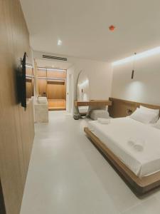 a hotel room with a bed and a desk at Cavo Drymades in Dhërmi