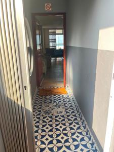 a hallway with a tile floor in a house at Margate Boulevard - Seaview Apartment in Margate