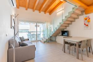 a living room with a couch and a table at Residenza Turistica Alberghiera Blue Marine in Bibione