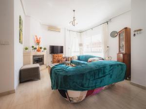 a living room with a couch and a table at Luxury Private Pool Villa Campoverde in Pinar de Campoverde +14 photos