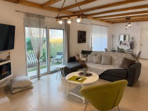 a living room with a couch and a table at Marilena's Houses in Kallithea Rhodes