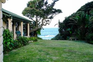 a house with a view of the ocean at Beach Cottage Abigail in Southbroom