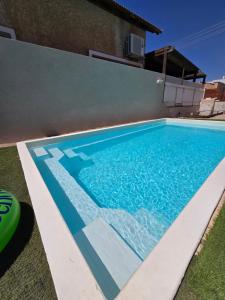 a swimming pool in the backyard of a house at Queen Indulgent suites for couples in Qiryat Ata