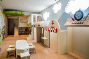 a childs room with a barbie train at Rich Palace Hotel in Surabaya