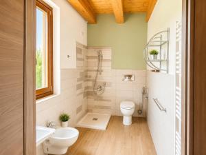 a bathroom with a shower toilet and a sink at Podere Meroli in Scorcetoli +43 photos
