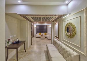 a living room with a couch and a table at Grand Continent Premiere - T Nagar in Chennai