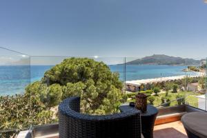 a view of the ocean from the balcony of a house at Saltwater Serenade Apartments in Zakynthos