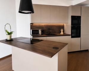 a kitchen with a counter top with a microwave at New Eurovea Tower in Bratislava