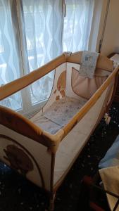 a small bed in a room with a window at Appartamento Miramare in Vado Ligure