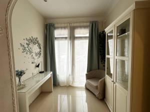a living room with a large window and a mirror at Rooms Granvia in Barcelona +21 photos