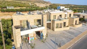 an overhead view of a building with a parking lot at Faros Elafonisi in Elafonisi +52 photos