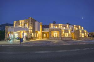 a building with lights on the side of a street at Faros Elafonisi in Elafonisi
