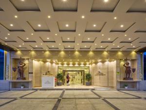 a view of the entrance to a building with statues at Grand Continent Premiere - T Nagar in Chennai