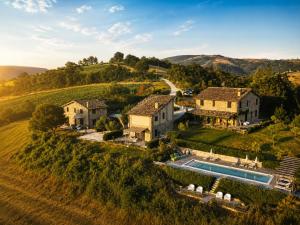 an estate in the hills with a swimming pool at Borgo Crispiero in Crispiero