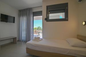 a bedroom with a bed and a mirror on the wall at Apex Premium Living in Leptokarya +24 photos