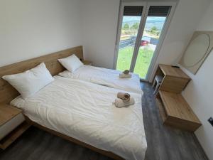 a bedroom with a bed with a teddy bear on it at Villa Verona in Mostar +41 photos