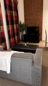 a living room with a bed and a fireplace at Mapungubwe Hotel in Johannesburg