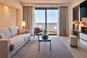 a living room with a couch and a table at Barceló Tenerife Royal Level in San Miguel de Abona