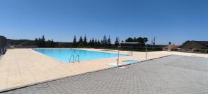 an empty swimming pool in a building at Villa Lamegal in Pinhel