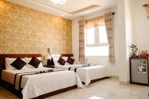 Ліжко або ліжка в номері Phan Rang Hotel