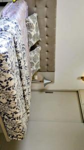 a room with a bed and pillows on the floor at The Palm Retreat Luxe 1bhk Near Thivim Station in Advolpale +12 photos