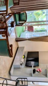 an overhead view of a room with a table and chairs at The Palm Retreat Luxe 1bhk Near Thivim Station in Advolpale