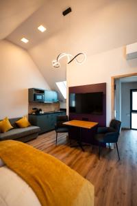 a living room with a couch and a table at Adler Apartments in Bach
