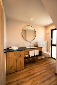a bathroom with a sink and a mirror at Adler Apartments in Bach +29 photos