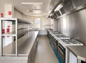 a large kitchen with stainless steel counters and appliances at Box Hill Student Accommodation and Rooming House in Box Hill