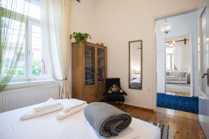 a white room with a bed and a mirror at Thalgiron, a breath away from Delphi in Ámfissa