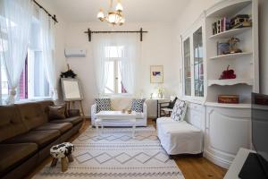 a living room with a couch and a chair at Thalgiron, a breath away from Delphi in Ámfissa
