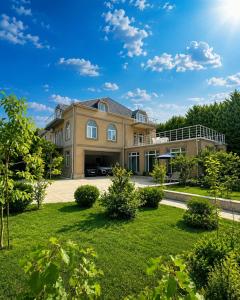 a large house with a yard at Bilgah Coast Villa in Baku