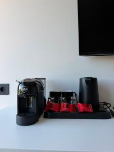 a toaster sitting on top of a kitchen counter at Soléa Himara Guesthouse in Himare