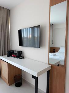 a hotel room with a desk and a mirror at Soléa Himara Guesthouse in Himare +15 photos