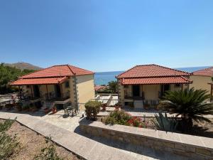 a house with a view of the ocean at Studios Edem in Agios Ioannis Kaspaka