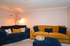a living room with two couches and a couch at Lochview at 33a in Gourock +22 photos