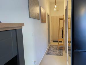 a hallway with a staircase leading to a room at LouAdria Apartments in Đenovići