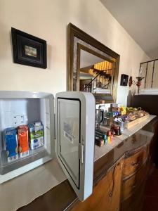 a refrigerator with its door open in a kitchen at Casa Nectarius in Cifuentes