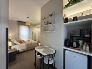 a living room with a couch and a table at Agorà Connect Space in Brindisi