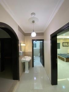 a bathroom with a sink and a bed at كازا in Taif +13 photos
