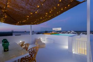 a patio with a table and chairs and a pool at DamnView Montargil Alentejo in Montargil