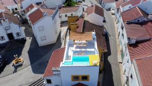 an overhead view of a house with a swimming pool on the roof at DamnView Montargil Alentejo in Montargil