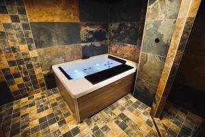 a bathroom with a bath tub in the middle at Moontain Lodge in Oz +85 photos