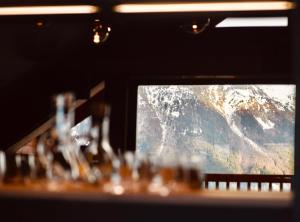 a table with a view of a mountain through a window at Moontain Lodge in Oz
