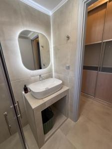 a bathroom with a sink and a mirror at Anassa Homes Leros in Agia Marina +41 photos