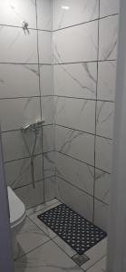 a bathroom with a shower with a toilet at centre reach otel in Edirne