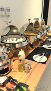 a buffet with many plates of food on a table at Jadeel Hotel in Al Khobar