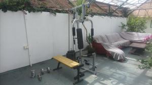 a room with a couch and a stage with a bench at Tree Tent Bratislava in Prievoz