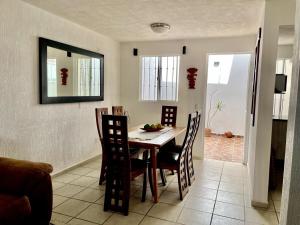 a dining room with a table and chairs at Casa Rincón Colonial, Confort y tranquilidad in San Miguel de Allende +11 photos