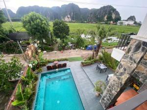 a view of a swimming pool from a house at Mountainview tam coc villa in Vũ Lâm